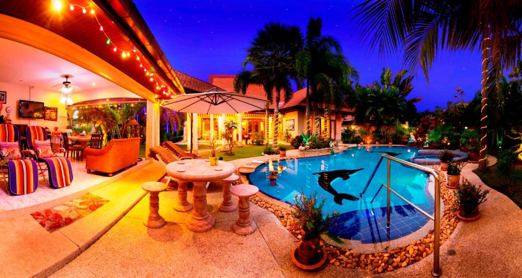 Nong Pla Lai Villa | Relaxing Palm Pool Villa, & Tropical Illuminated Garden & Private Swimming Pool.