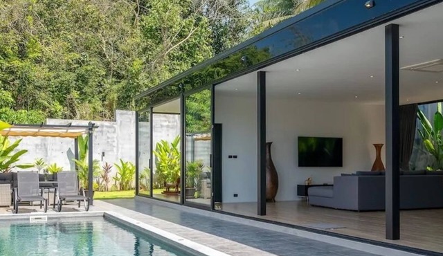 Modern 2-bedroom oasis with private pool, garden, and dedicated workspace, ideal for families in Tambon Mae Nam
