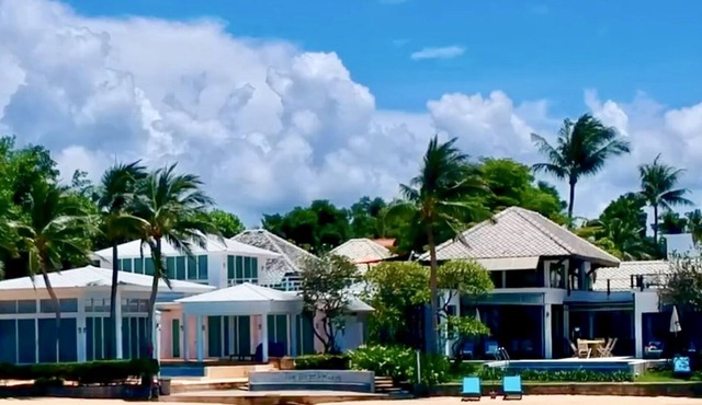 Superb 4 bedroom villa on the beach with a private swimming pool .