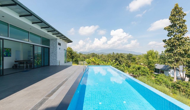 Swimming pool along the terrace, panoramic view surrounded by nature in หางดง